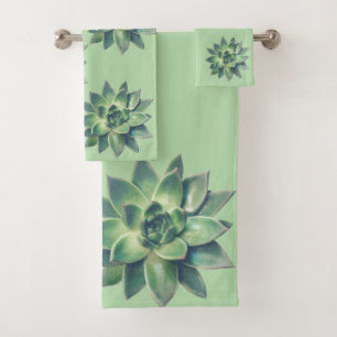 Moderne sappige plantenbladeren op lichtgroen bad handdoek