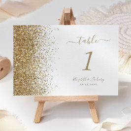 Moderne witte trouwtafel met gouden glinsterende r kaart