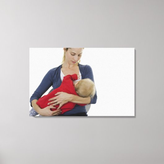 Moeder geeft haar baby. canvas afdruk (Voorkant)