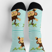 Moeie aap hangend aan een liaan gestreepte sokken (Top)