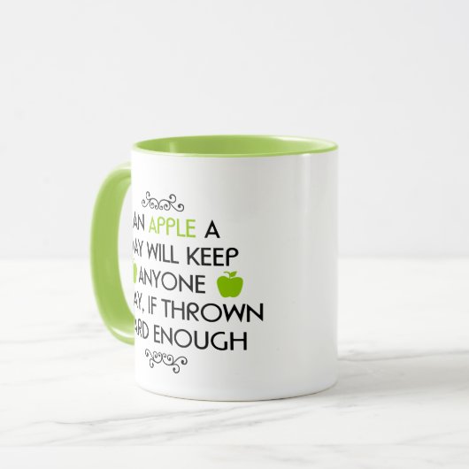 Mok 11 oz. (ounce) met "Een Apple a Day" (Voorkant links)