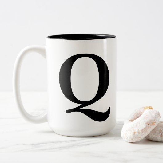 mok "Q" (Met donut)