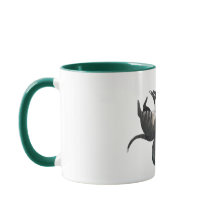 Mok | Twee katten liggen bij een plant