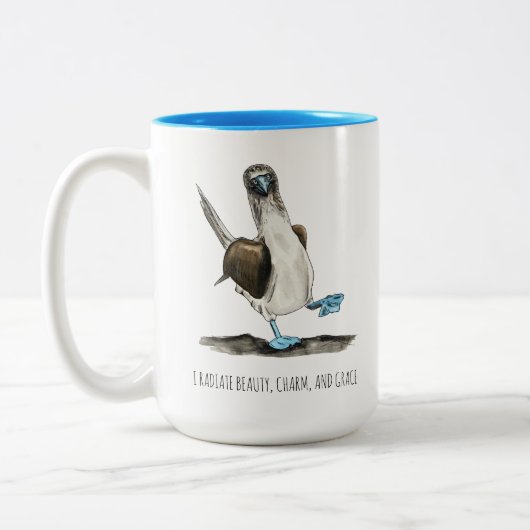 Mok van tweetone koffie met blauw-voetgebaseerde v (Links)