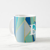 Mok voor het geometrisch monogramma van zeeglas (Voorkant links)