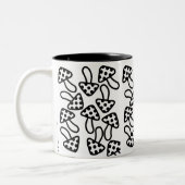 Mok zwarte en witte paddenstoelen (Links)