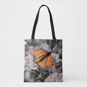 Monarch Butterfly op gedempte roze en grijze bloem Tote Bag