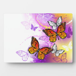 Monarchvlinders op paarse achtergrond fotoplaat