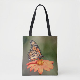 Monboogvlinder op een oranje bloem tote bag