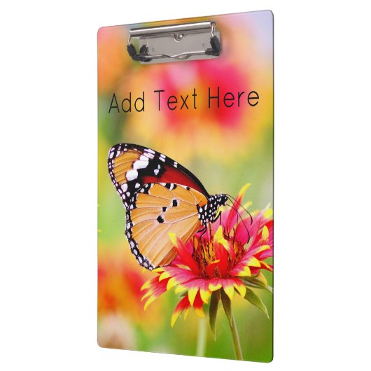 Monboogvlinder op rode en gele bloem klembord (Links)