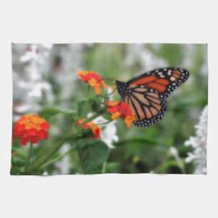 Monboogvlinder op Sinaasappel en rode lantana Theedoek