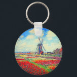 Monet Tulips Windmill Sleutelhanger<br><div class="desc">Sleutelhanger met de bloem van Claude Monet en het schilderij van de windmolen. Mooie en kleurrijke velden van rode,  roze en gele tulpen naast een windmolen en huis in Nederland. Een geweldige cadeau van Monet voor supporters van indrukwekkende tonen en Franse kunst.</div>