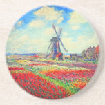 Monet Tulips Windmill Zandsteen Onderzetter<br><div class="desc">Onderzetter van zandsteen met de bloem van Claude Monet en het schilderij van de windmolen. Mooie en kleurrijke velden van rode,  roze en gele tulpen naast een windmolen en huis in Nederland. Een geweldige cadeau van Monet voor supporters van indrukwekkende tonen en Franse kunst.</div>