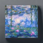 Monet Waterlelies Plaque Fotoplaat<br><div class="desc">Monet Waterlelies-plaat. Olieverfschilderij op canvas uit 1916. Monet schilderde obsessief zijn beroemde waterleliesvijver tijdens de laatste jaren van zijn carrière, waarbij hij inspiratie putte uit het licht van de zon en het veranderende effect ervan op het water en de water- en bloemen en het gebladerte. Dit schilderij toont een levendig...</div>