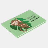 Monkey op een toonboek over een wijnontwerp gastenboek (Hoek)