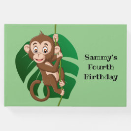 Monkey op een toonboek over een wijnontwerp gastenboek