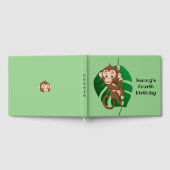 Monkey op een toonboek over een wijnontwerp gastenboek (Volledig)