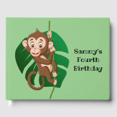 Monkey op een toonboek over een wijnontwerp gastenboek (Voorkant)