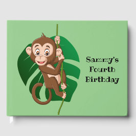 Monkey op een toonboek over een wijnontwerp gastenboek
