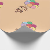 Monkey vliegt omhoog met een kleurrijke ballonkaar cadeaupapier (Hoek)