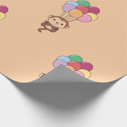 Monkey vliegt omhoog met een kleurrijke ballonkaar cadeaupapier (Hoek)