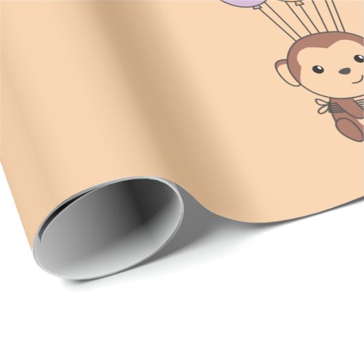 Monkey vliegt omhoog met een kleurrijke ballonkaar cadeaupapier (Rol Hoek)