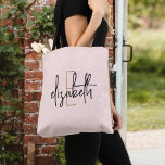 Monogram Blush Pink Tote Bag<br><div class="desc">Maak een statement met deze prachtige monogram zwart-witte canvas tas. Deze stijlvolle tas biedt moderne, scriptbelettering in een elegant ontwerp dat overal waar u gaat hoofden zal draaien. Met veel ruimte voor uw benodigdheden en een unieke stijl, zal deze tas zeker een go-to accessoire worden dat u graag zult shows....</div>