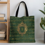 Monogram Crest Music Manuscript Groen Goud Tote Bag<br><div class="desc">Dit elegante  ontwerp is voorzien van goudkleurige handgeschreven bladmuziek manuscript op een donkere smaragdgroene en gouden achtergrond. Personaliseer het met uw monogram initiaal in Gotische lettertype gezet door een  antieke gouden kuif lijst.</div>