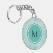 Monogram en vlinder op mintgroene kleur sleutelhanger (Voorkant Links)