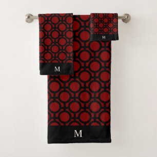 Monogram en zwarte abstracte cirkels op rood bad handdoek