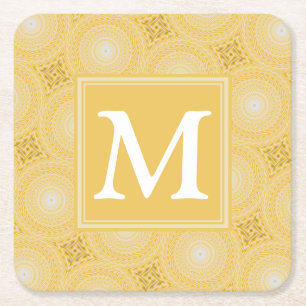 Monogram geel cirkelpatroon kartonnen onderzetters
