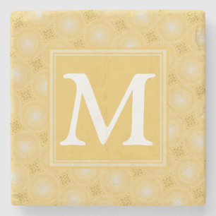 Monogram geel cirkelpatroon stenen onderzetter