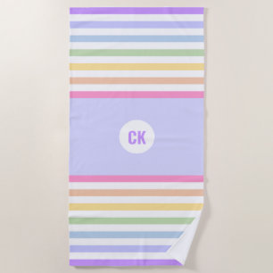 Monogram in witte cirkel pasta regenboogstrips strandlaken