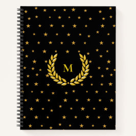 Monogram, lauwerkrans en gouden sterren op Zwart Notitieboek