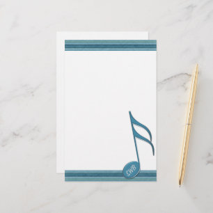 Monogram muzieknotitie en strips in de schaduw van briefpapier