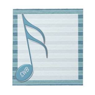 Monogram muzieknotitie en strips in de schaduw van notitieblok