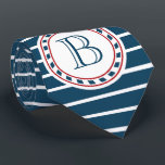 Monogram ontwerp stropdas<br><div class="desc">Kunstmatige vormgeving met monogramdecoratie in ronde vorm op blauwe en witte gestreepte achtergrond</div>