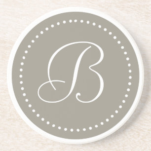 Monogram rond aluminium/witte stip rand zandsteen onderzetter