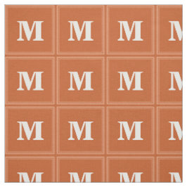 Monogram sinaasappel stof