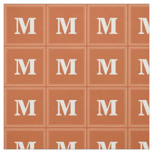 Monogram sinaasappel stof