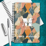 Monogram tropisch patroon planner<br><div class="desc">Uw monogram en voornaam in chique letters op een abstracte tropische print in blauwgroen,  koraal,  roze,  tan en goud is afgedrukt op deze gepersonaliseerde planner. Ideaal voor jezelf of een geweldig cadeau voor elke gelegenheid.</div>