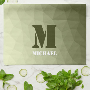 Monogram van het groene, geometrisch maaspatroon v theedoek