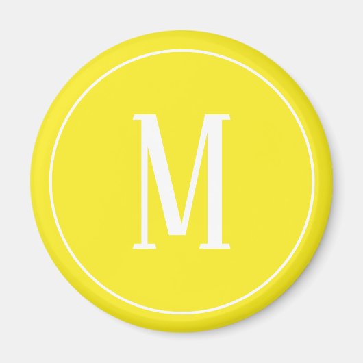 Monogram wit op gele ronde magneet (Voorkant)