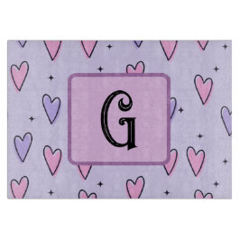 Monogramtekening van grillige kleine hartjes roze snijplank