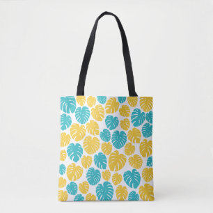 Monstera bladeren in turkoois, geel en wit tote bag