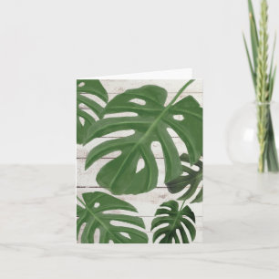 Monstera lekt blanco briefkaart op houten planken