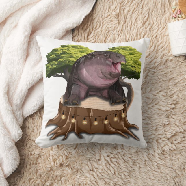 Moo Deng Hippo zit aan een boom. Kussen (Deken)