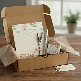 Mooi bloemenkader met monogram notitieblok