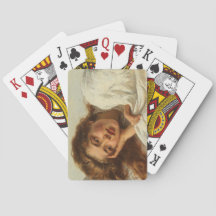 Mooi meisje dat in bed ligt met rood haar