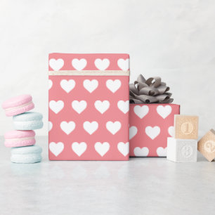 Mooi patroon van witte harten in mooie roze kleur cadeaupapier